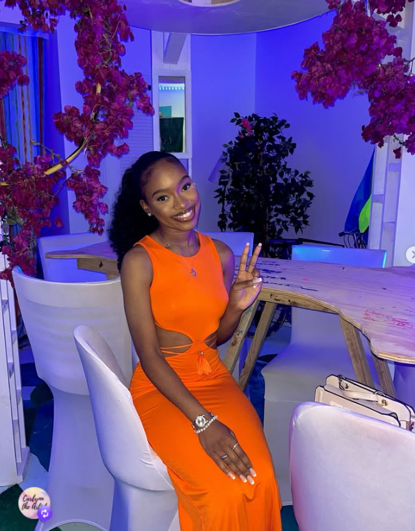Carlynn in an orange dress